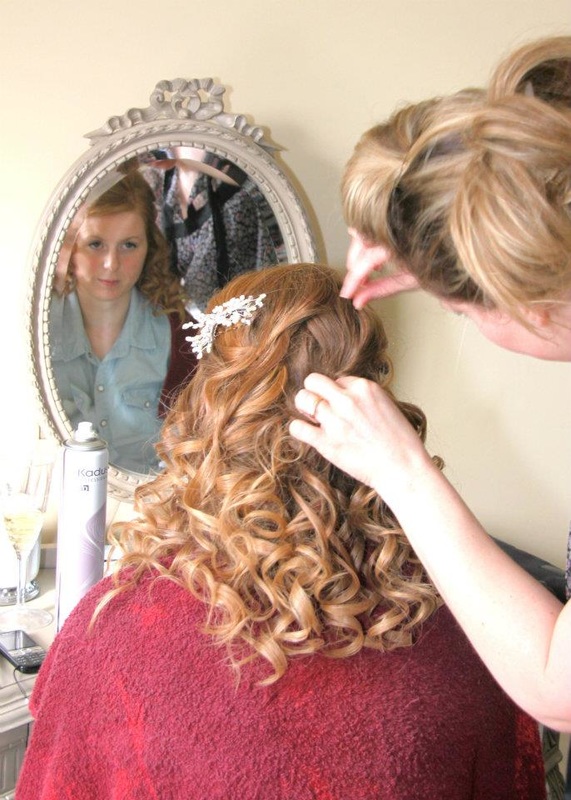 Karen Lowe of Karen's Beautiful Brides working on a brides hair