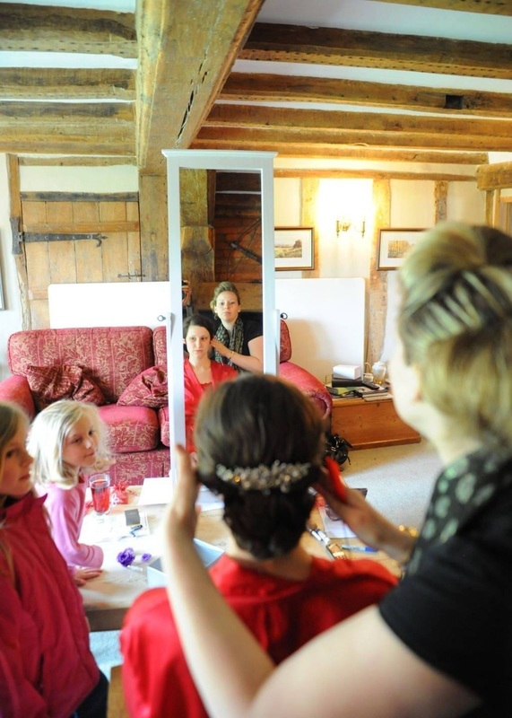 Karen Lowe of Karen's Beautiful Brides putting the finishing touches to the brides hair - best photo