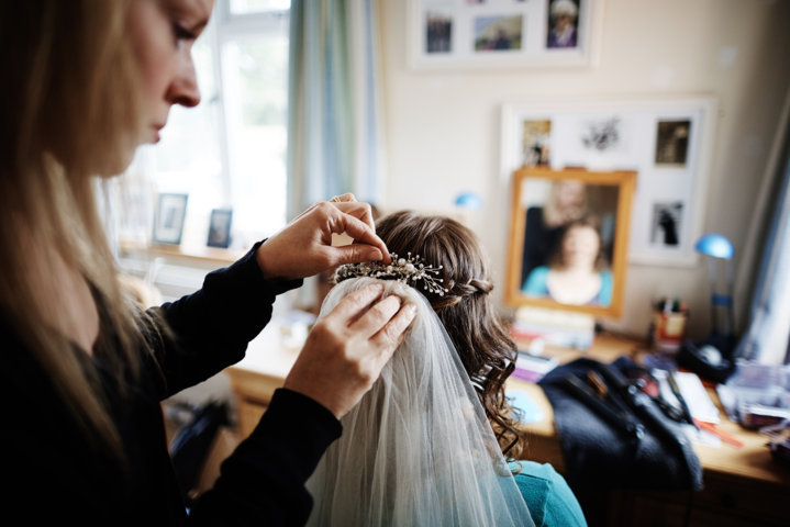Suffolk wedding hairdresser Karen, of Karen's Beautiful Brides, creating a brides hair style