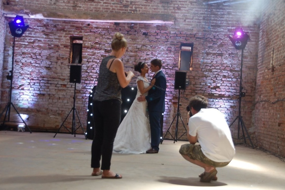Taking photos of a brides at a wedding venue photoshoot in Copdock Hall Barn, Ipswich Suffolk