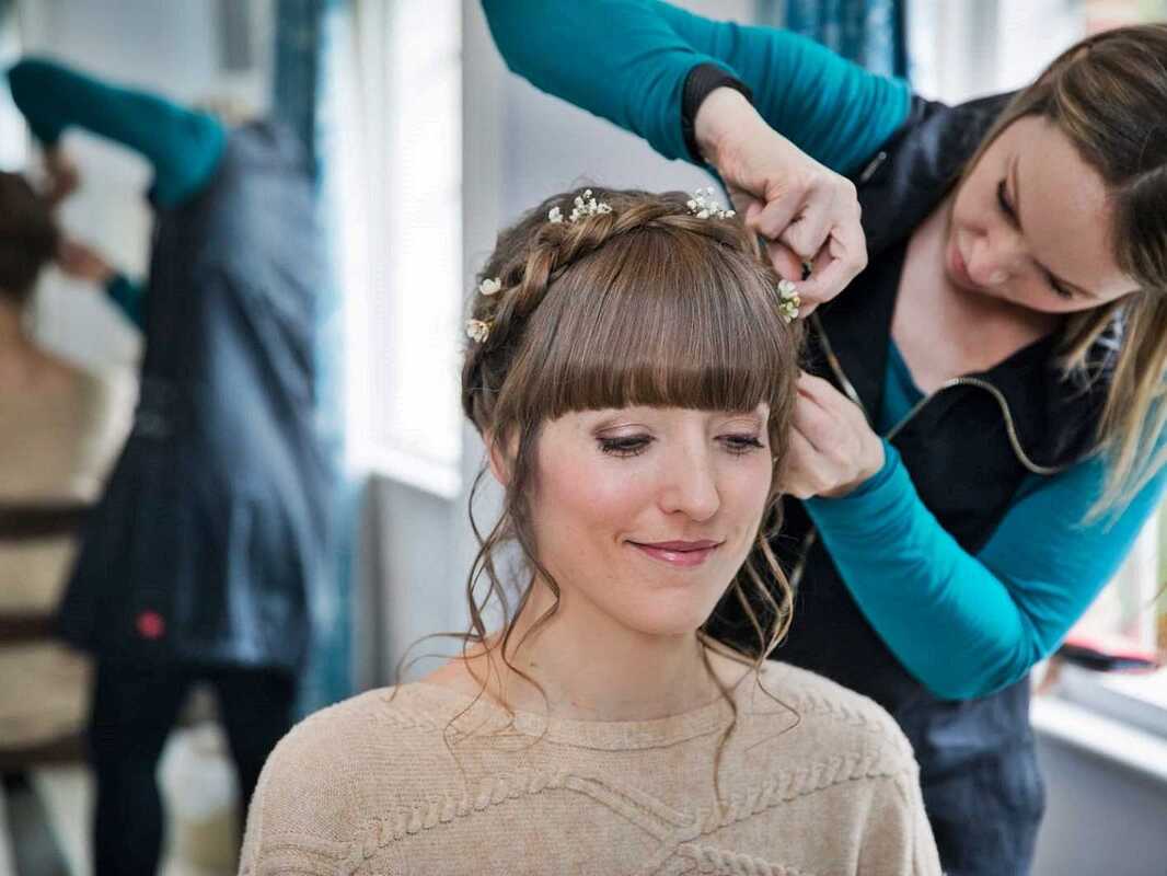 Karen Lowe of Karen's Beautiful Brides working on wedding hair, plaited crown braid