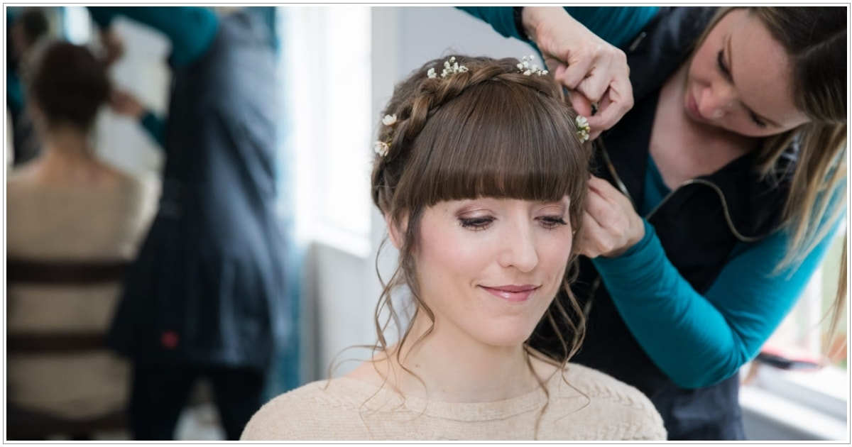 Best photo of Karen Lowe of Karen's Beautiful Brides putting the finishing touches to the brides hair